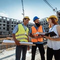 Construction workers, having a discussion on a building site