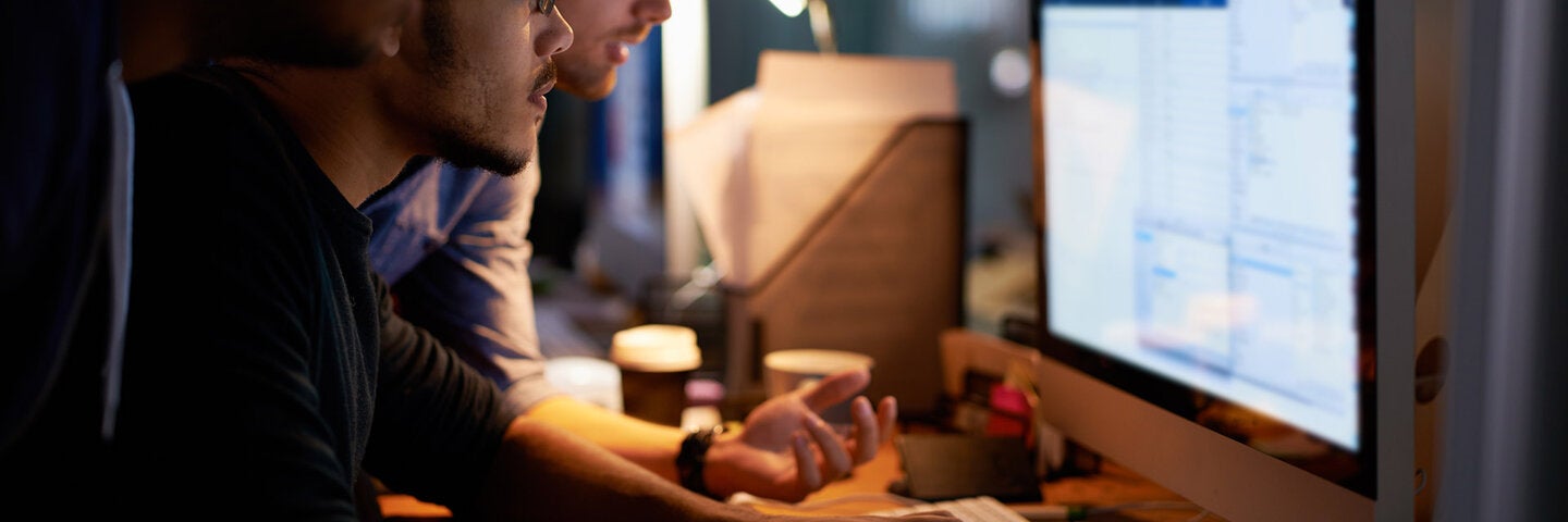 two men working on computer