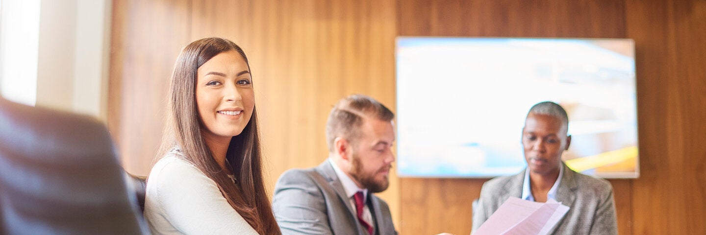 one female two males in conference room