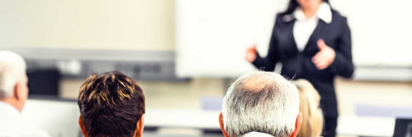Adults sitting in a seminar