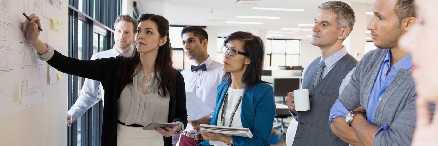 Group of students at a whiteboard