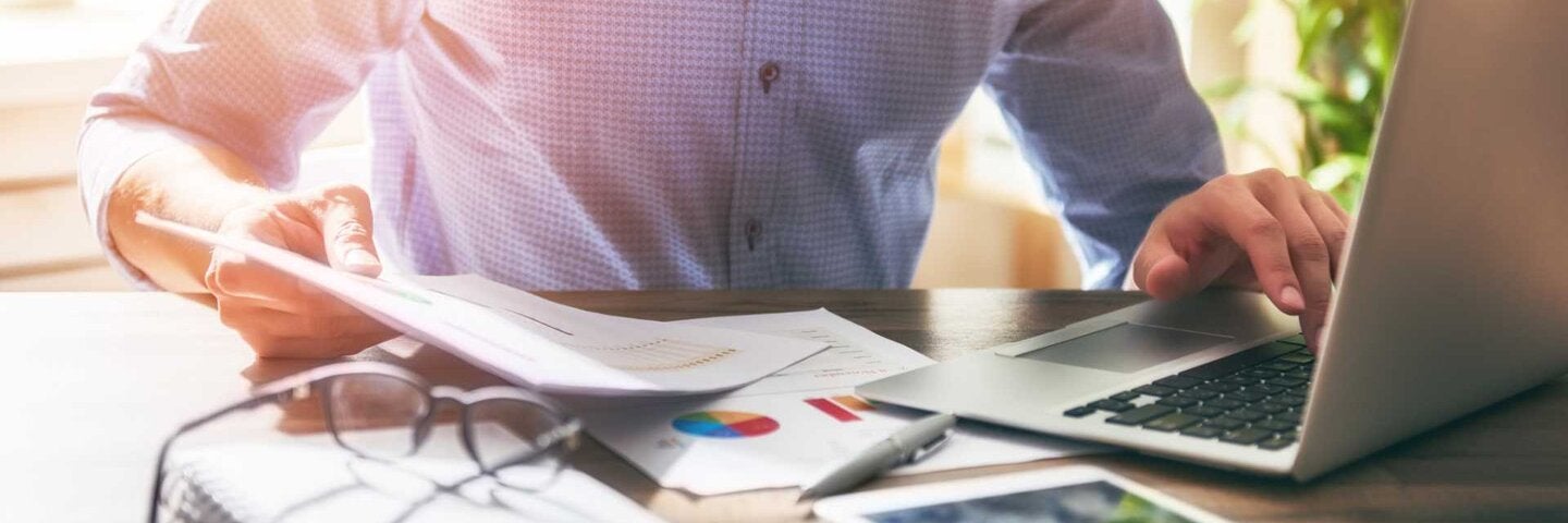 Man working on financials in office