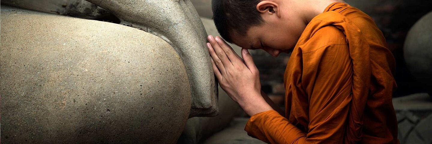 Monk worshiping Buddha