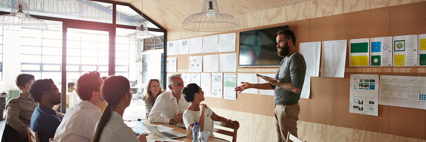 Man making a creative presentation in a modern conference room