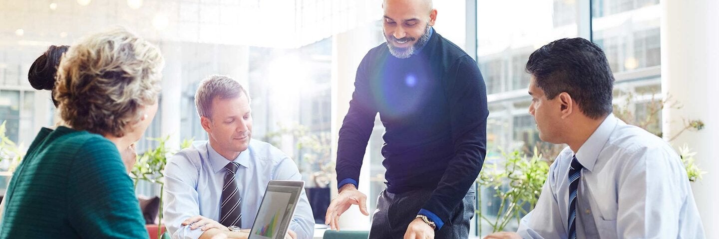 An impromptu brainstorm meeting in modern office.