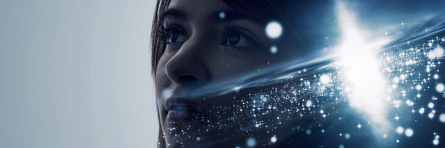 Woman looking into the distance with space image super-imposed on her shadow