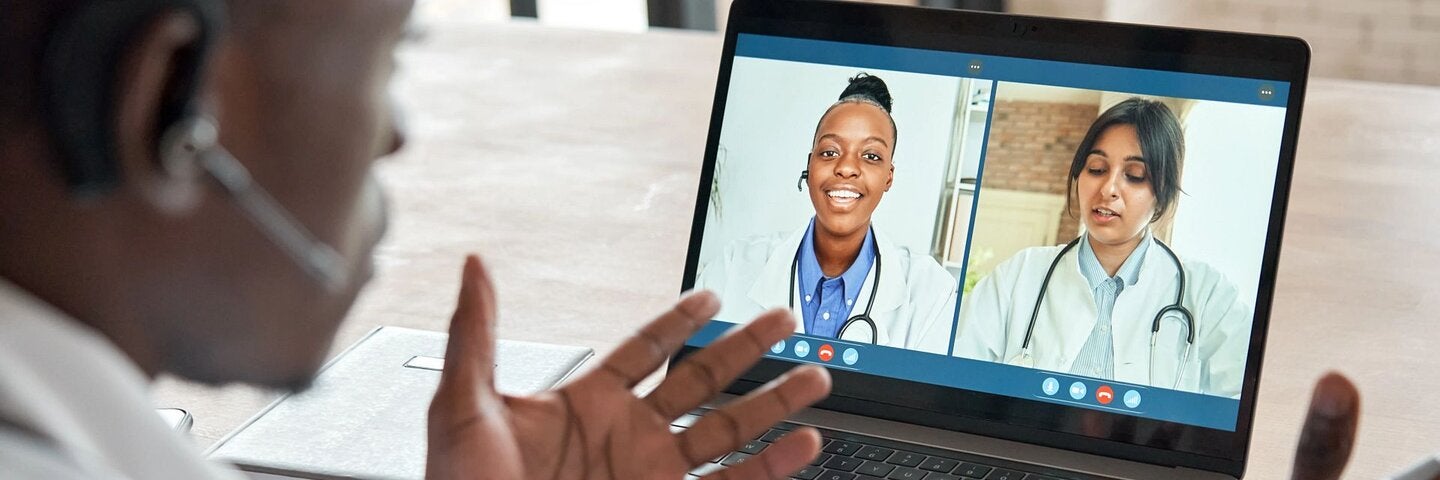 Multicultural doctors team conferencing in video call chat discussing health care learning online during web seminar.