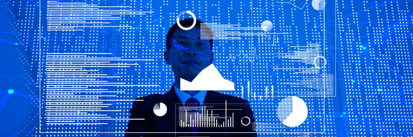 man standing looking at screen