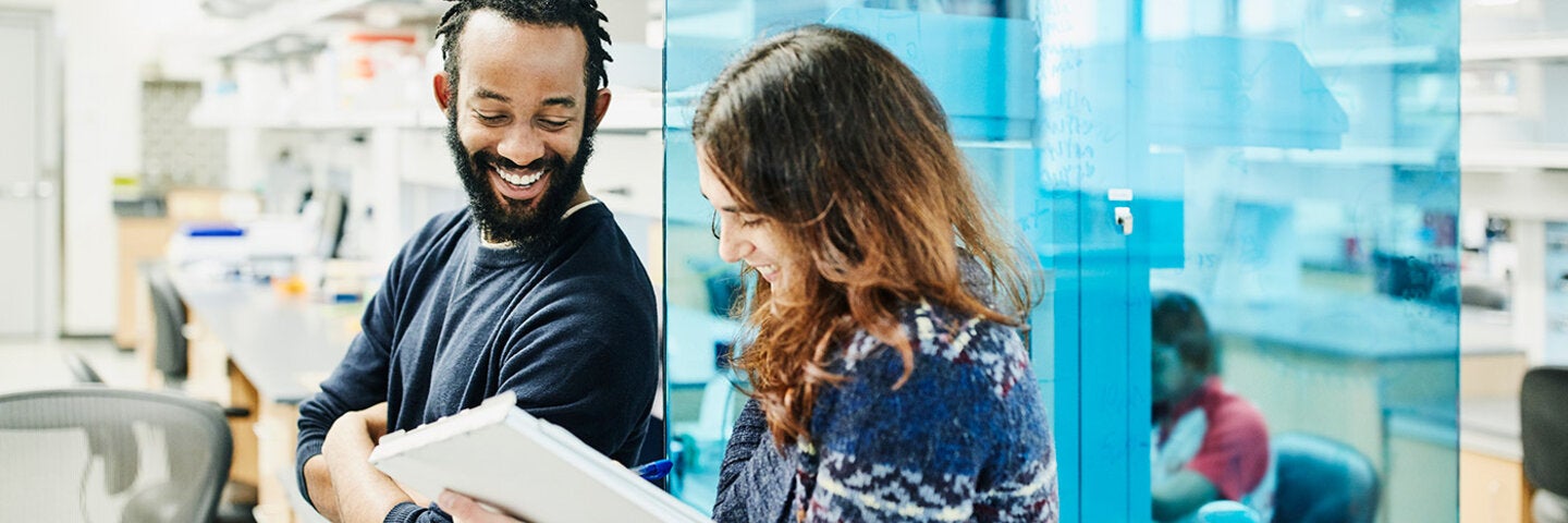 colleagues in discussion at the laboratory