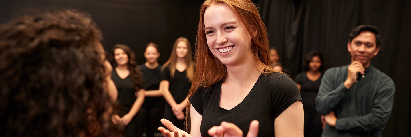 Actors practicing on stage