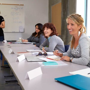 writers sitting in collaborative space discussing a topic