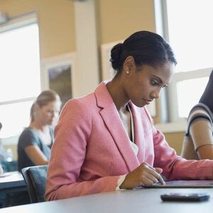 A woman studying at a desk