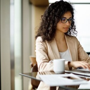 young woman using her laptop