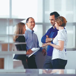 Four people having a discussion - Interior Design Open House